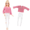A fashion doll outfit set featuring a pink fuzzy sweater and white ripped pants.
