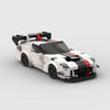 A detailed model of a classic supercar built from white, black, and red building blocks.
