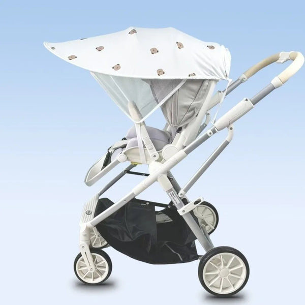 A white lightweight UV resistant sunshade canopy is shown attached to a baby stroller.