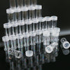 A collection of clear plastic storage bottles arranged in a pyramid formation.