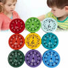 A set of nine colorful math fidget spinners showing multiplication practice for kids.