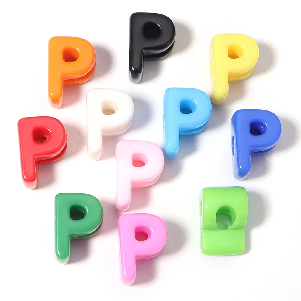A collection of colorful acrylic letter P beads in various shades including orange, black, yellow, pink, blue, and green.
