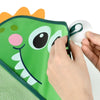 A hand is attaching a suction cup to a green and orange toy storage bag featuring a frog design.