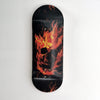 Black skateboard deck with a UV-printed graphic of a flaming skull.