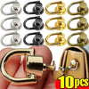 A collection of vintage metal D-ring buckle clips in silver, black, and gold colors shown against a hand and a leather bag.