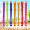 A set of eight colored transparent ABS recorder flutes: purple, green, blue, yellow, orange, red, and pink.