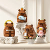 A set of cute desktop models made from brown and pink building blocks depicting a bear, a capybara, and a fish.