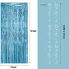 A vertical banner featuring blue, striped geometric shark shapes and a hanging garland set.
