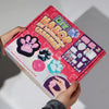 A box of a DIY squishy making kit with liquid gel and silicone, featuring various squishy molds and tools.