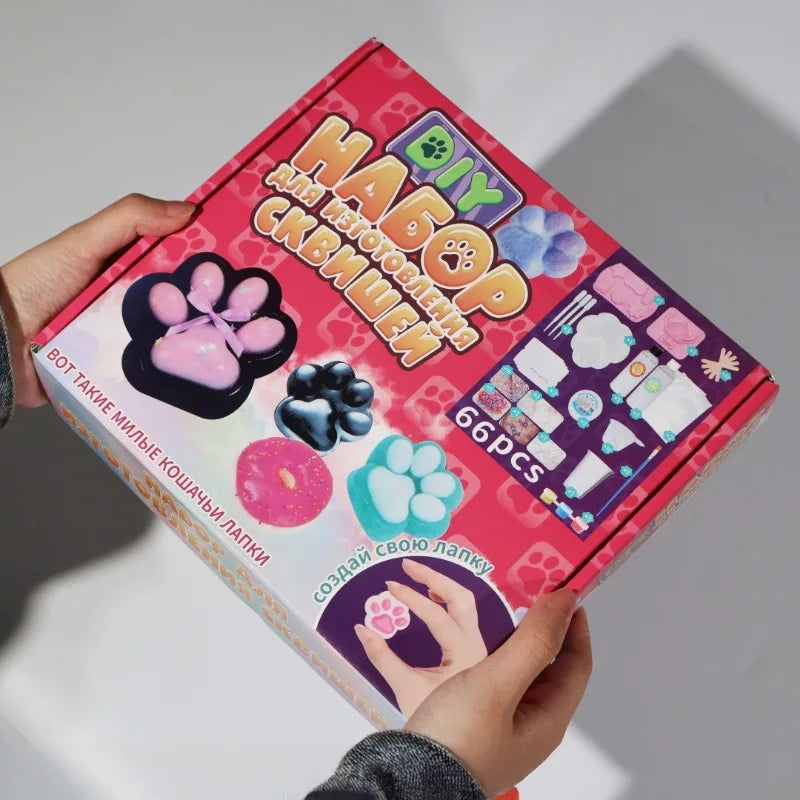 A box of a DIY squishy making kit with liquid gel and silicone, featuring various squishy molds and tools.
