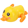 A bright yellow bath toy shaped like a duck with orange feet and beak.