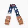 A navy blue canvas belt with white stars and red stars, featuring a leather buckle.