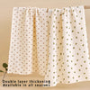 Two double layer thickening baby gauze swaddle blankets in cream with a yellow floral pattern hanging on a wooden rod.