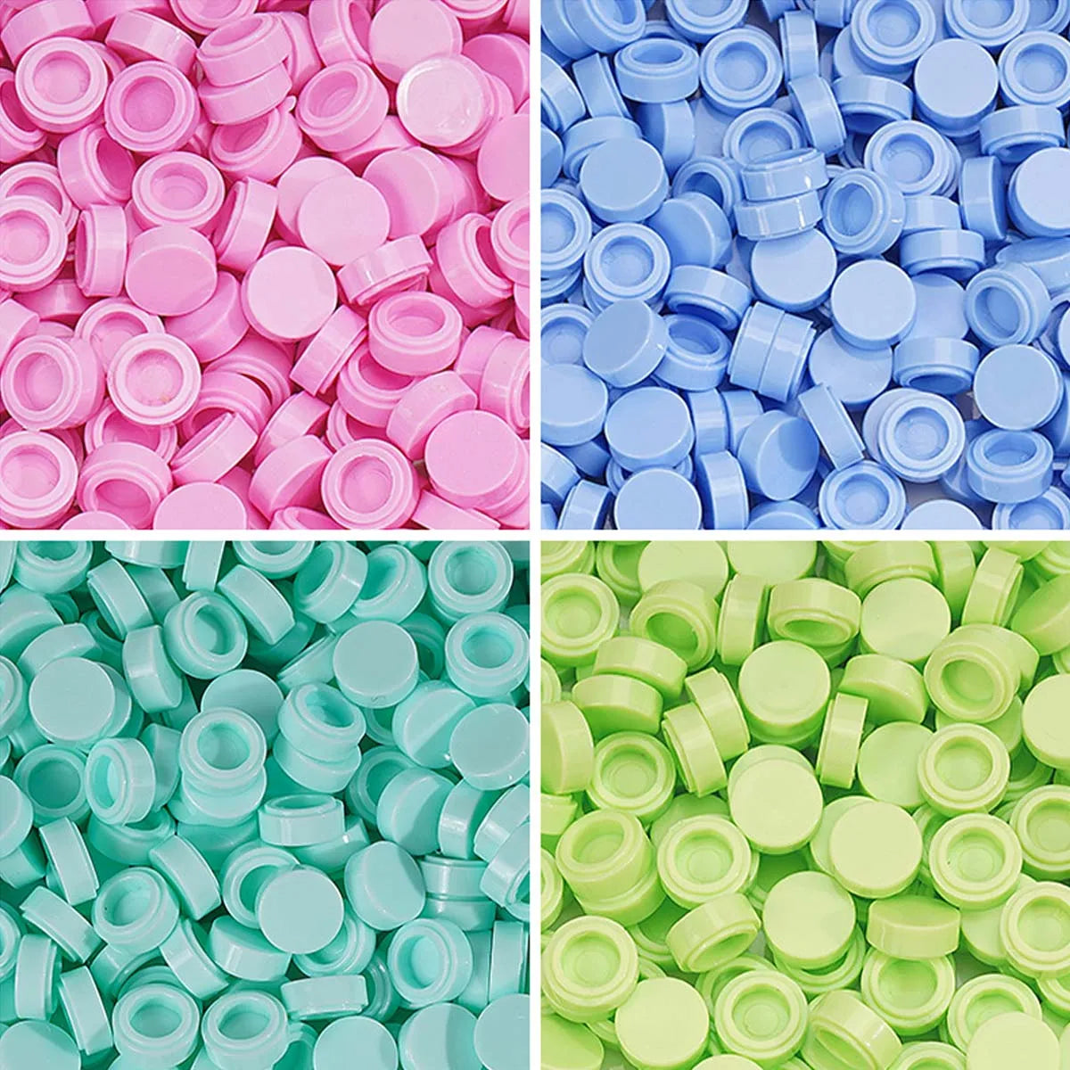 A close-up of various colors of plastic bead filler or clay pellets in different shades of pink, blue, and green.