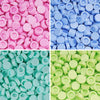 A close-up of various colors of plastic bead filler or clay pellets in different shades of pink, blue, and green.
