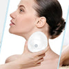 A woman is using an electric scalp and body massager for facial and body massage.