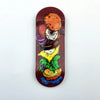 A wooden fingerboard deck featuring a vibrant UV-printed graphic of a hamburger and lettuce.
