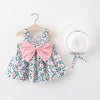 A baby girl summer dress and sunhat set featuring floral patterns and pink bow details.