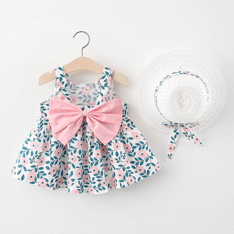 A baby girl summer dress and sunhat set featuring floral patterns and pink bow details.