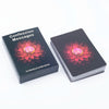 A black box containing a 54-card oracle deck with a floral design and a central gem.