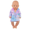 A baby doll wearing a purple and blue striped bathrobe or nightgown set.