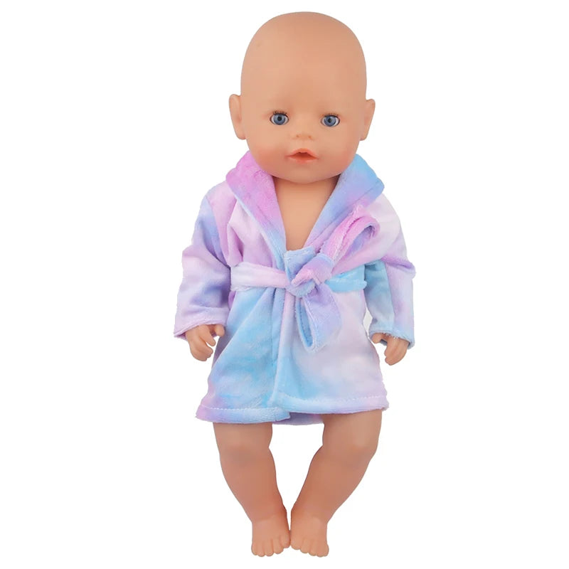A baby doll wearing a purple and blue striped bathrobe or nightgown set.