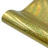 Close-up of a gold holographic glitter heat transfer vinyl material rolled into a tube.