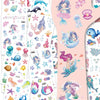 A collection of glitter mermaid temporary tattoos featuring various sea creatures and underwater scenes on pink paper sheets.