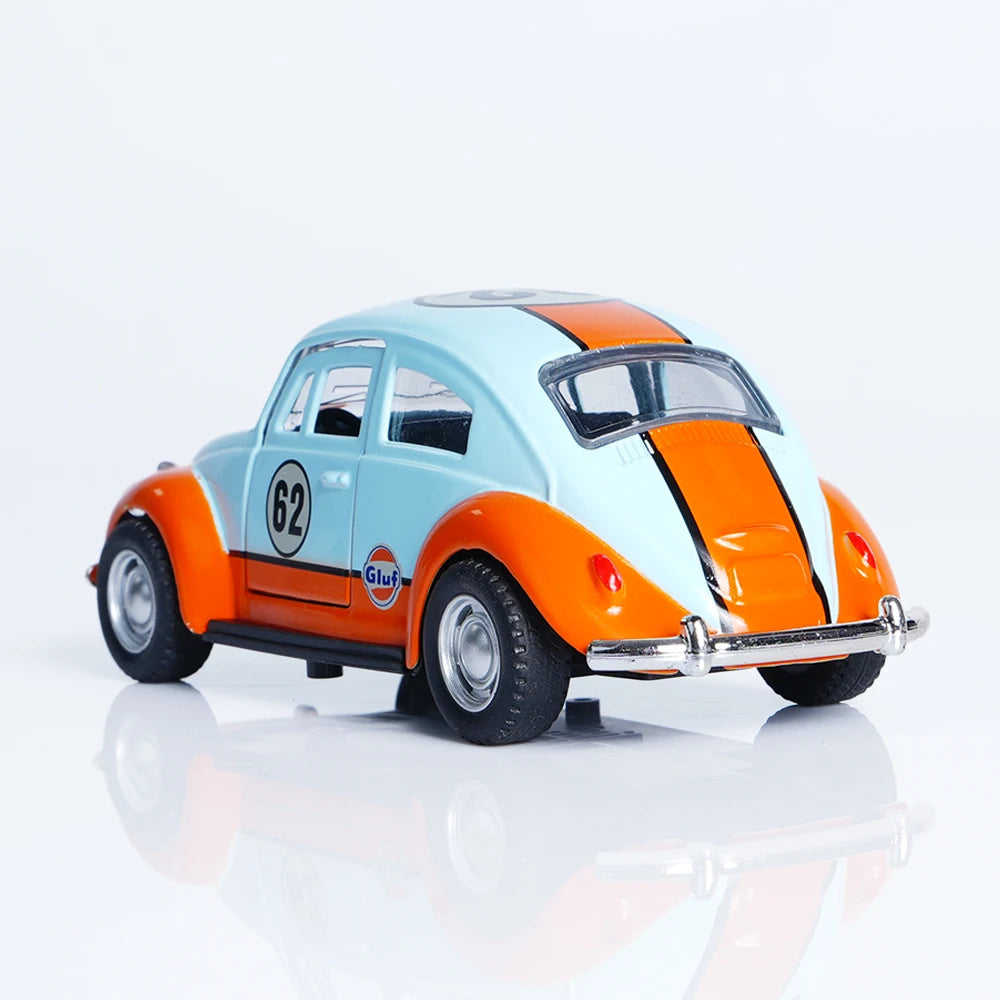 A 1:36 scale die-cast retro Beetle car painted orange and light blue with racing numbers on the hood.