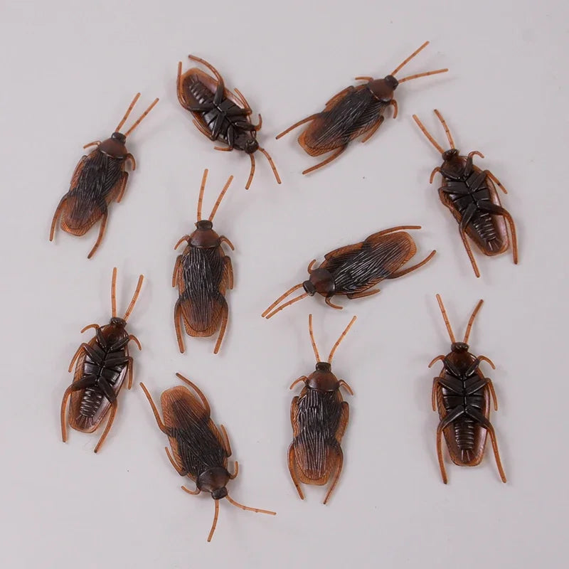 A collection of lifelike fake cockroaches props for pranks and Halloween