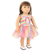 A doll wearing a pink and yellow unicorn themed outfit with a sparkly skirt and matching top.