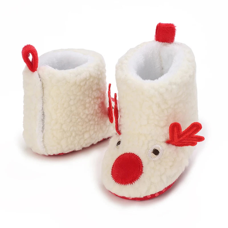 A pair of adorable animal-themed baby first walker shoes with white fluffy material and red accents.