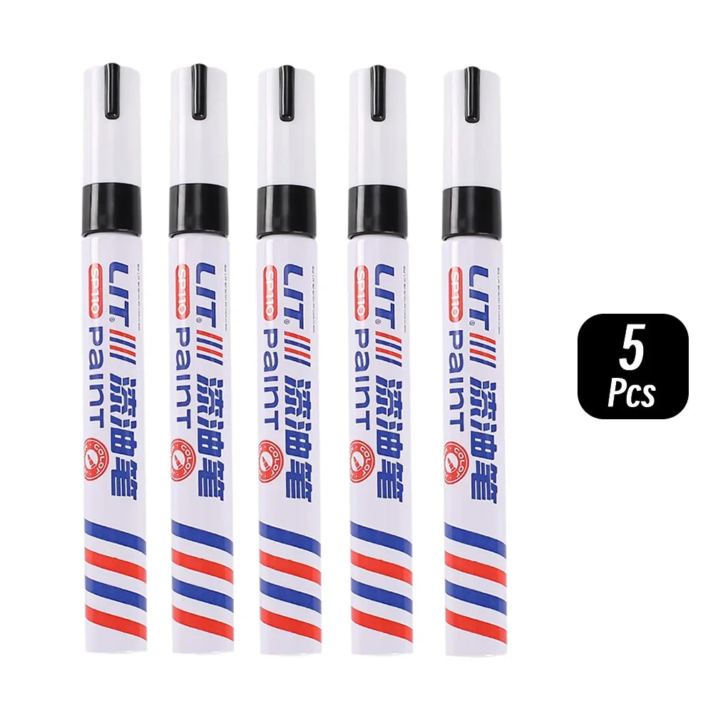 Eight permanent paint markers in black and white packaging are displayed in a row.