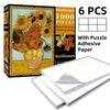 A box of a 1000-piece sunflower jigsaw puzzle with adhesive paper and six pieces.