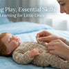 A woman gently interacts with a sleeping baby doll wearing a cozy winter romper outfit.