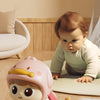 A baby doll resembling a character named Duck is shown on a floor, used for kinetic crawling fun guidance.