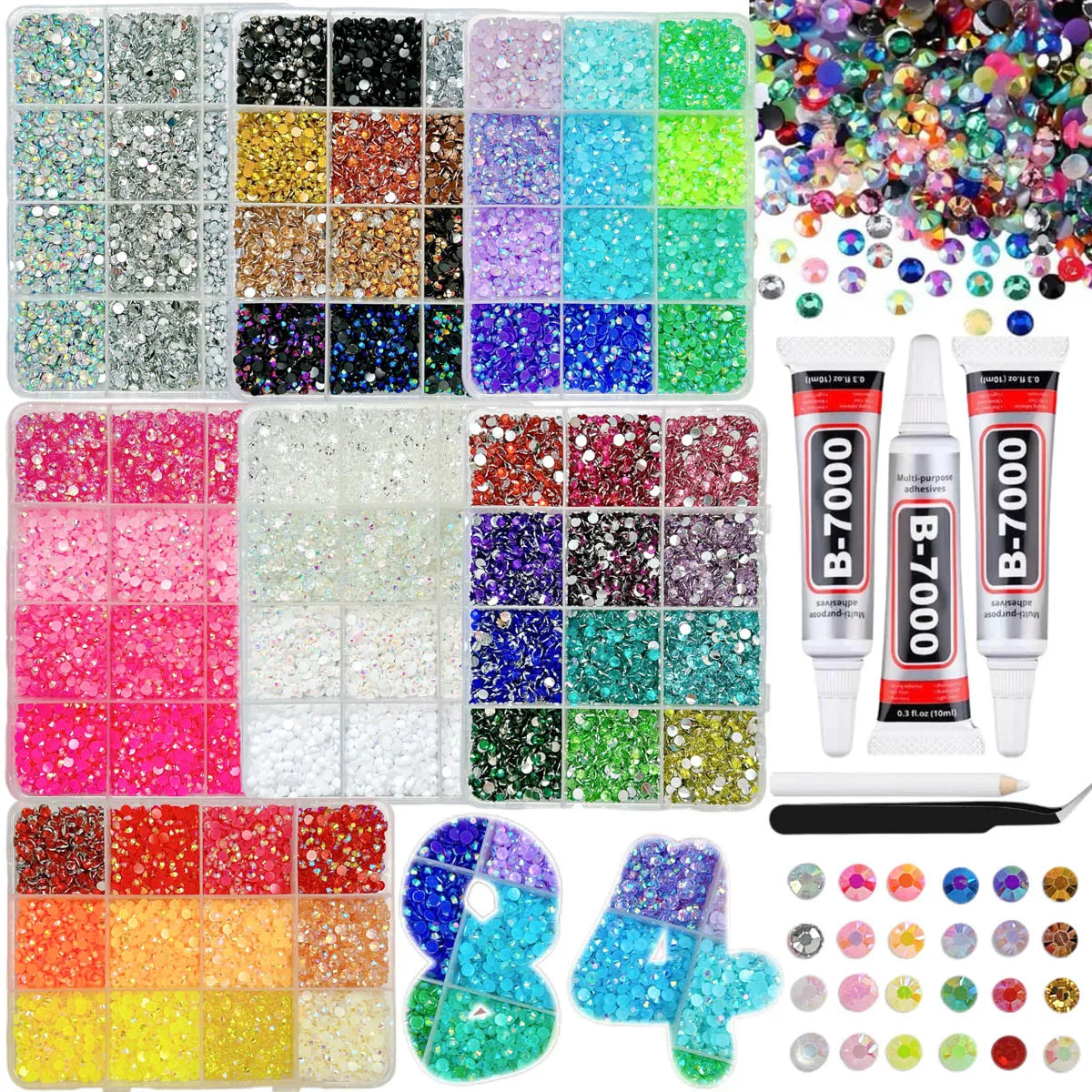 A collection of multi-style rhinestones and glitter in various colors arranged in small compartments and loose piles.