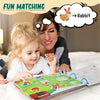 A mother and child are playing with a Montessori busy book featuring rabbit cutouts for quiet learning.