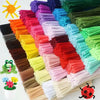 A large collection of colorful chenille stem craft sticks in various shades and lengths arranged in rows.