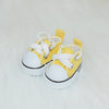 A pair of yellow casual sneakers with white laces and soles, suitable for 17cm Labubu dolls.