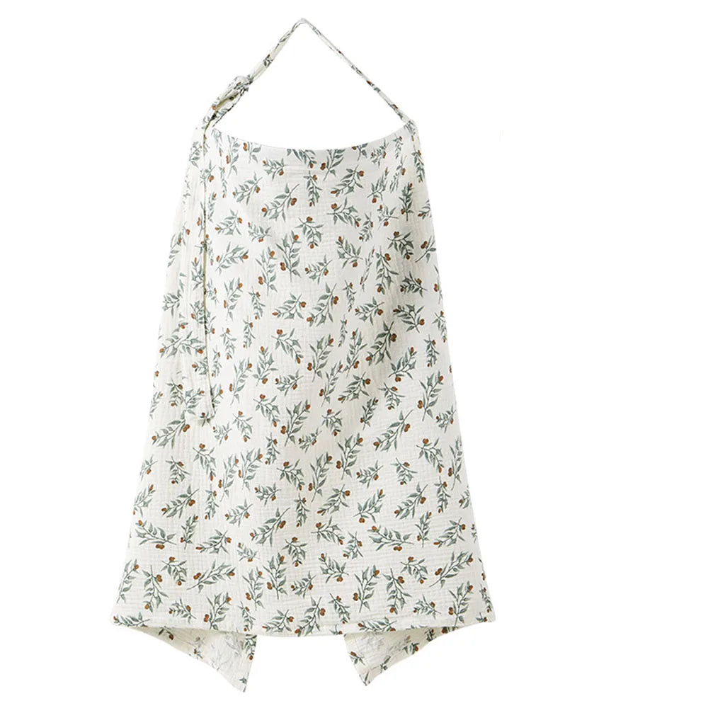A white breathable muslin nursing cover with a delicate floral print and adjustable neckline.