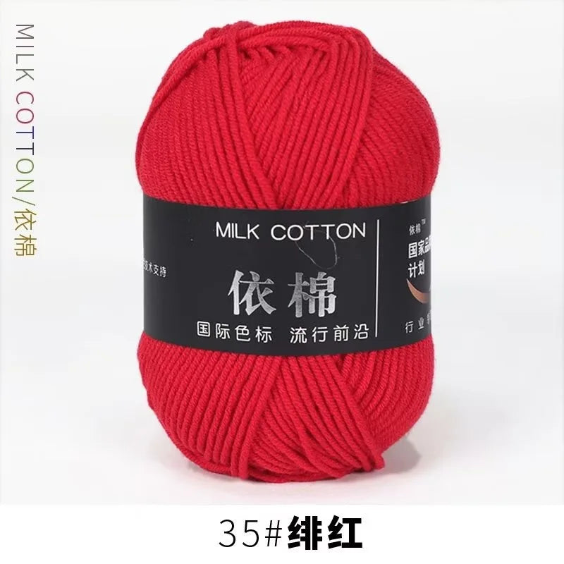 A ball of bright red milk cotton yarn labeled 35# silk thread for knitting and crochet.
