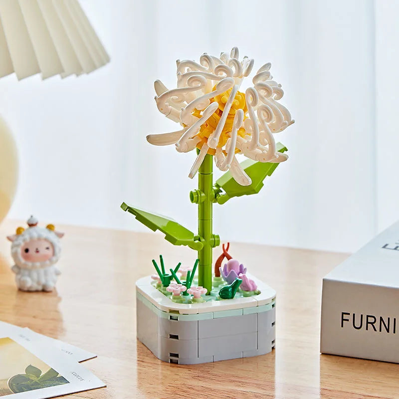 A set of rose flower building blocks in shades of yellow and green displayed on a wooden table.