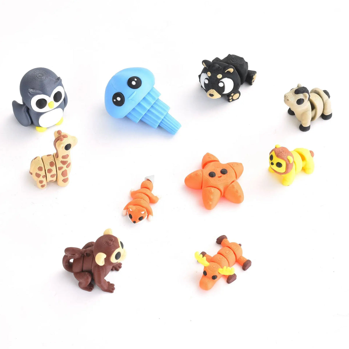 A set of poseable 3D printed animal figurines including an owl, a cat, a giraffe, and a tiger in various colors.