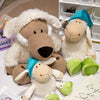 A soft plush toy of a wolf dressed in sheep's clothing, alongside another sheep-like stuffed animal.
