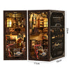 A wooden book nook kit featuring a detailed Japanese alley miniature scene with built-in LED lights.
