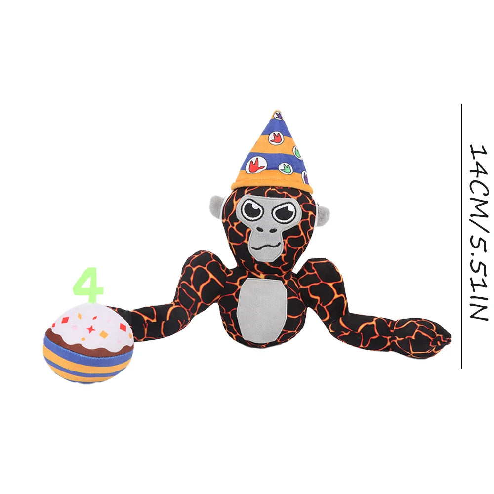 A black and gray gorilla plush toy wearing a conical party hat with colorful decorations.
