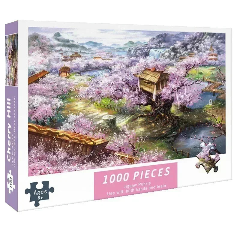 A box of a 1000-piece jigsaw puzzle featuring a scenic landscape with pink blossoms and a wooden structure.