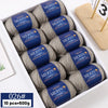 A box of 10 skeins of YEDAN MERIN worsted wool thread yarn for knitting projects.