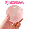 A hand holds a pink maltose squishy stress relief toy.